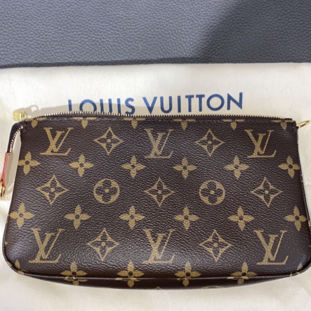 Authentic Louis Vuitton pochette accessoires in monogram canvas